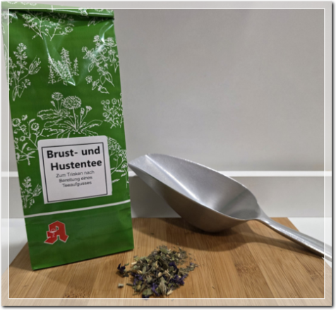 Der grüne Teebeutel mit Teekelle